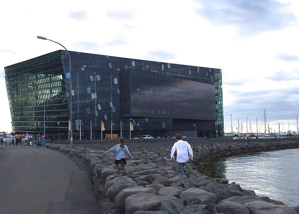 Things to do in Reykjavik - Harpa Concert Hall Reykjavik Seawall with Opera House in Background