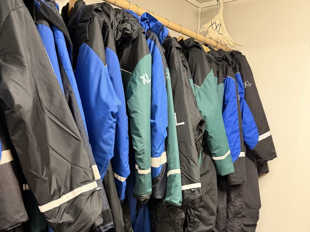 Ski suits on a rack in Svalbard