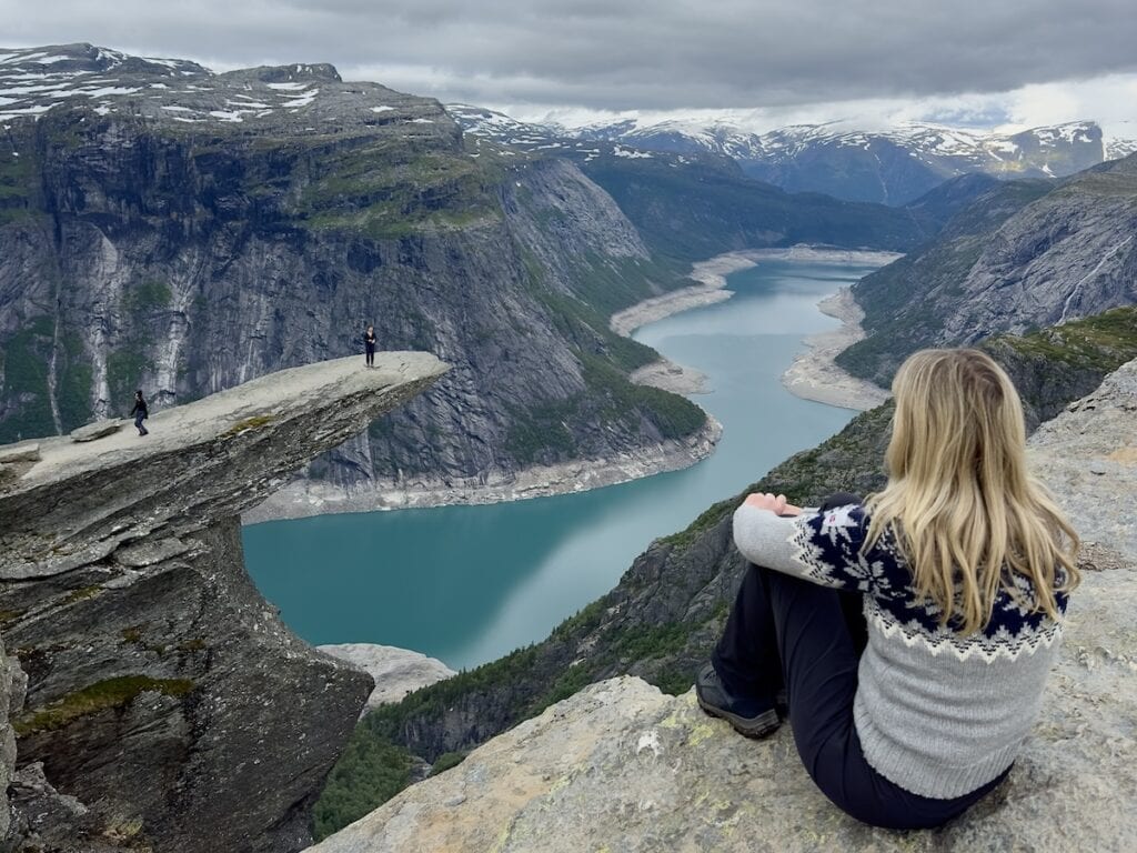 Woman looking at Trolltunga