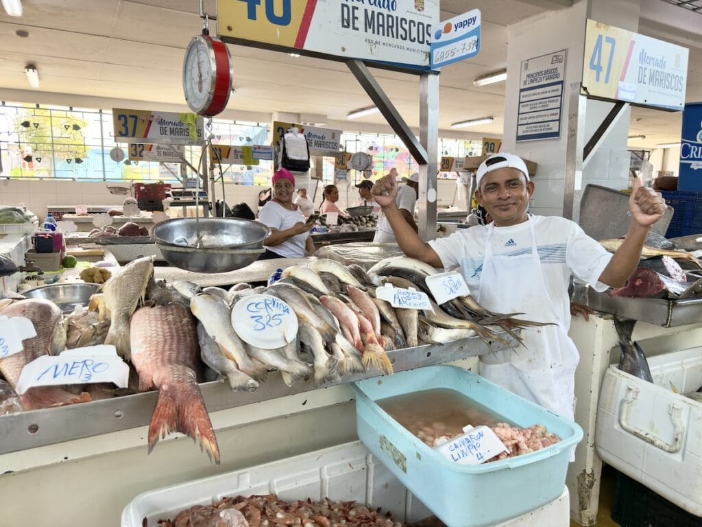 A vendor showing of his fish at the Panama City Fish Market (Mercado de Mariscos)