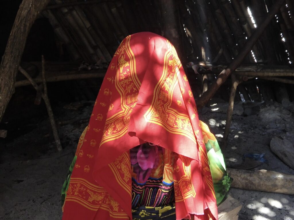 A Guna woman in a colourful headscarf