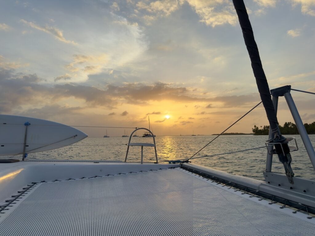 Sunset from the bow of a catamaran sailboat in the San Blas Islands