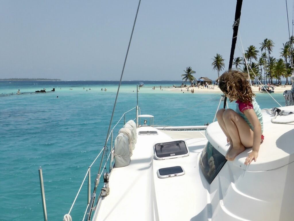 Child on a catamaran sailboat in the San Blas Islands